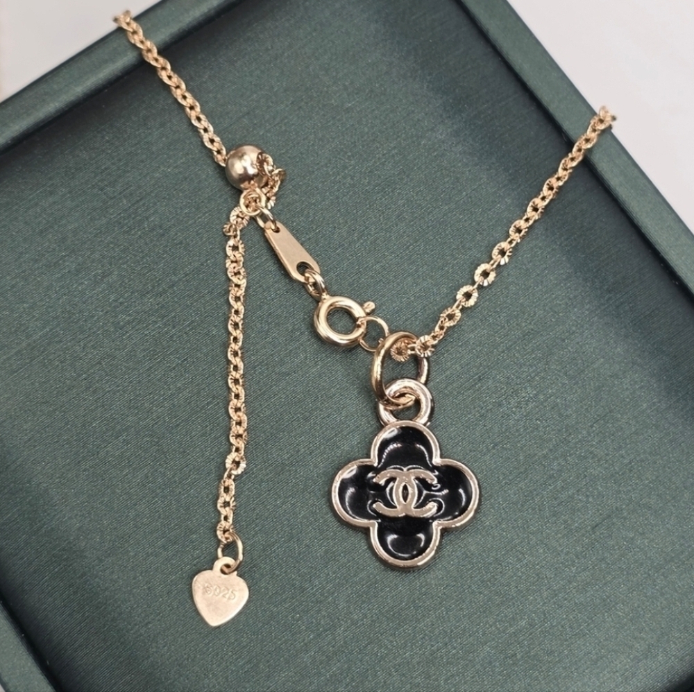 SOLD ..CHANEL Gold and Black Clover Necklace